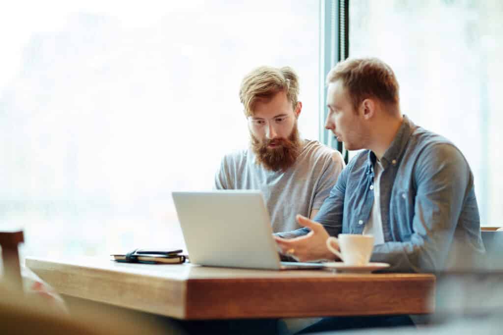 IT consultant sitting with a client