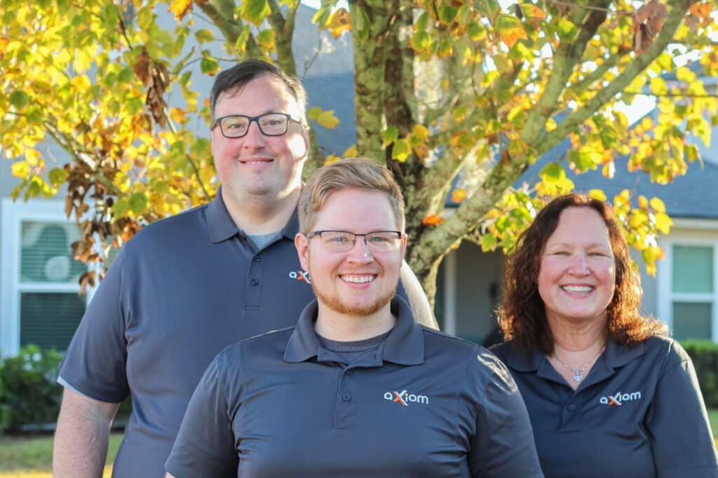 Axiom IT Company workers smiling inside a Jacksonville neighborhood