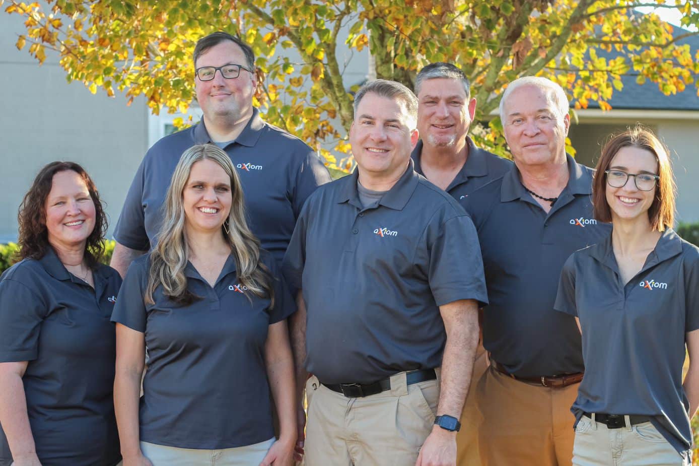 Axiom IT Company workers smiling inside a Jacksonville neighborhood