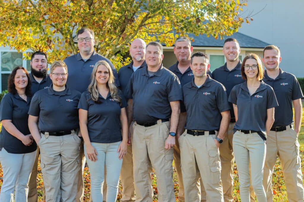 Axiom IT Company workers smiling inside a Jacksonville neighborhood