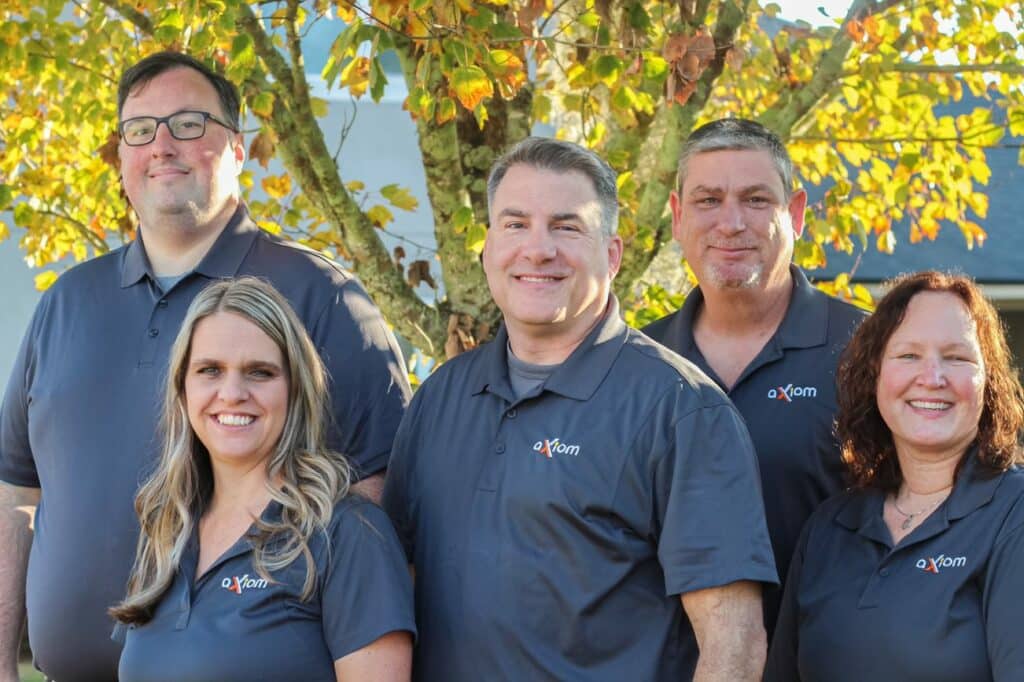 Axiom IT Company workers smiling inside a Jacksonville neighborhood