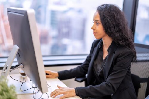 employee working on computer using it services